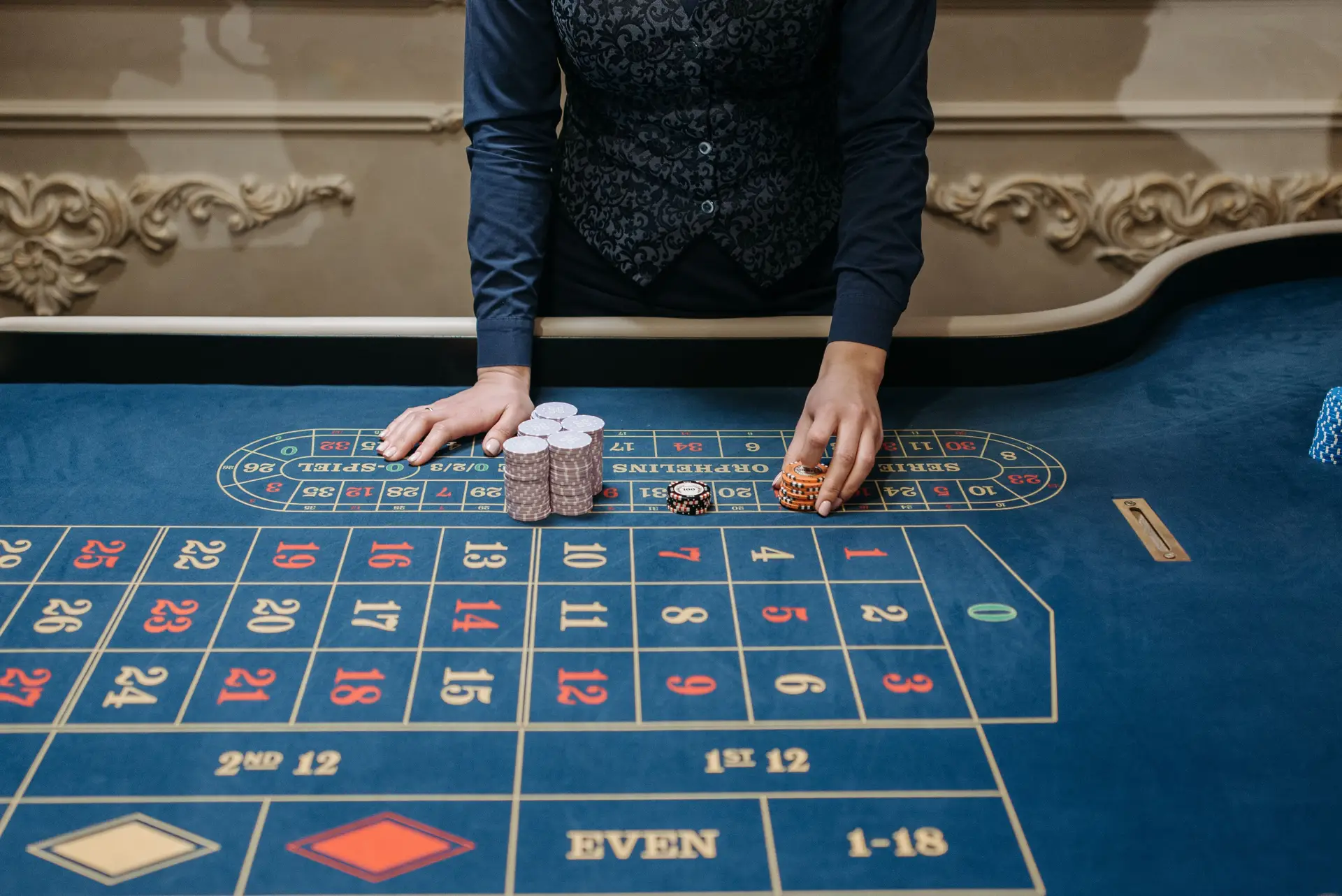 Attentive casino dealer at a luxury table
