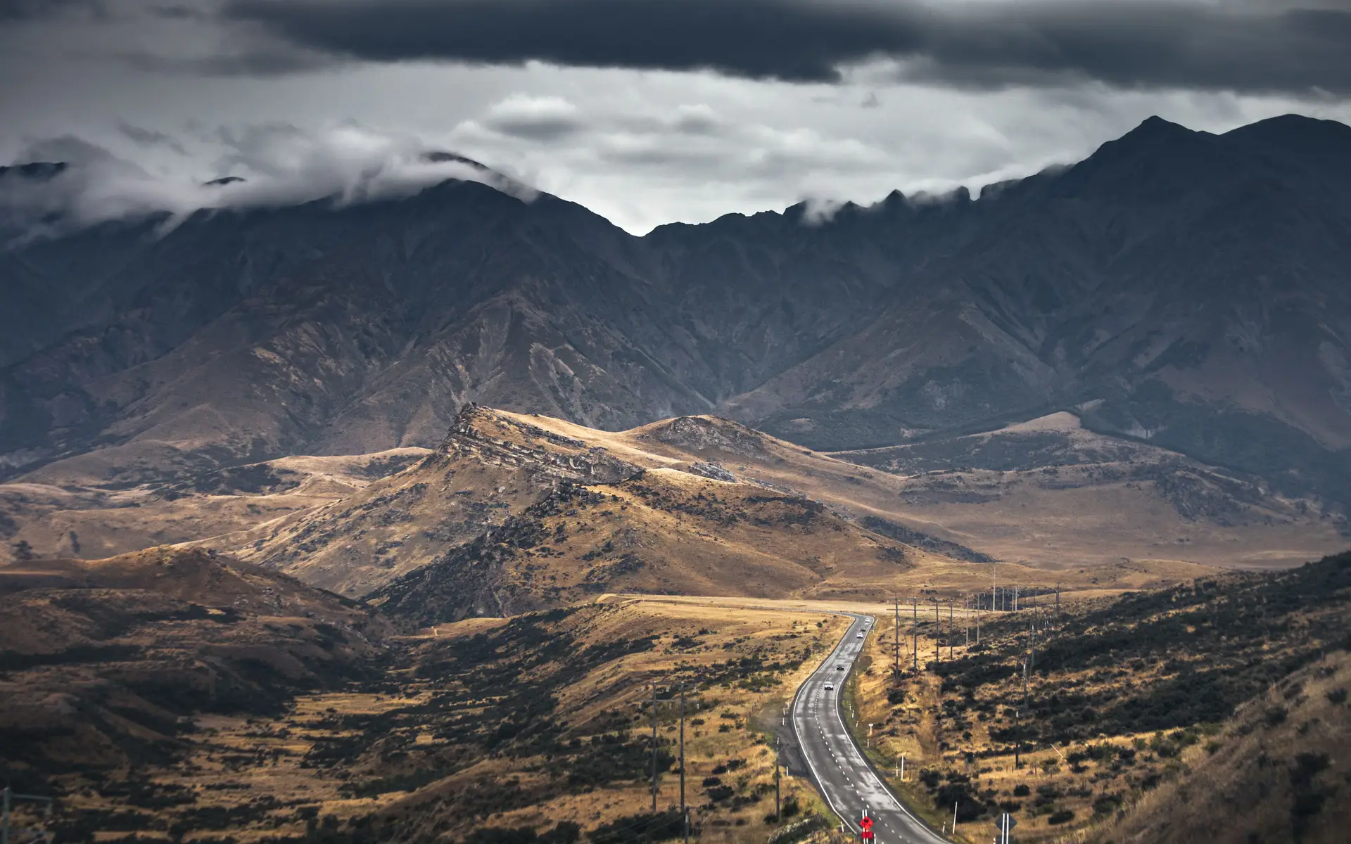 Scenic road in New Zealand mountains leading to MeravelleroyalLodge